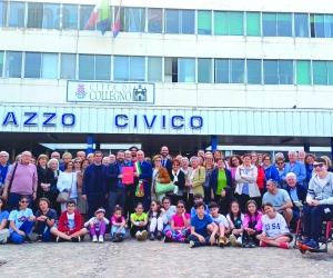 Collegno, abbraccio tricolore per don Romeo